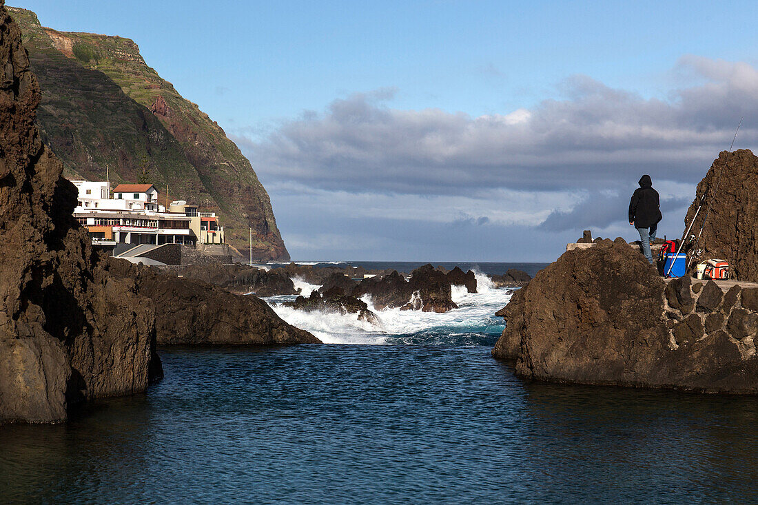 fishers and breaking waves, porto-moniz, madeira, portugal.