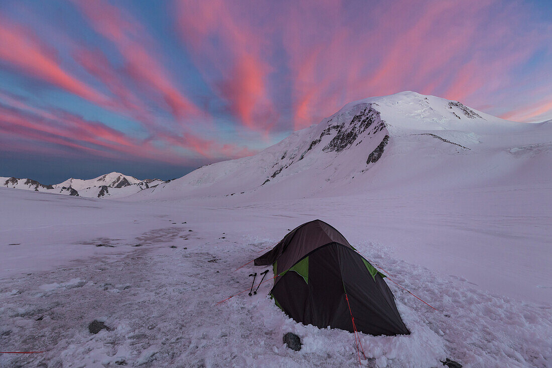 last light of day and reddening sky over a tent at the foot of mount khuiten, tavan bogd massif, altai, bayan-olgii province, mongolia