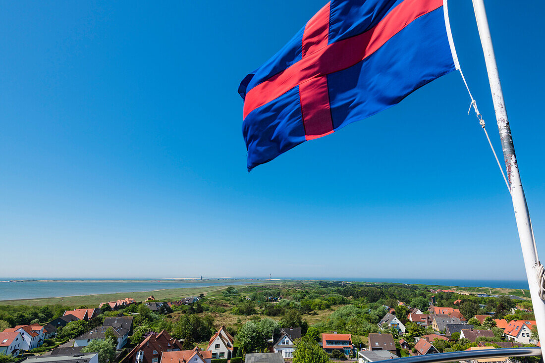 View from the old lighthouse with flag Oldenburger Land, Wangerooge, East Frisia, Lower Saxony, Germany