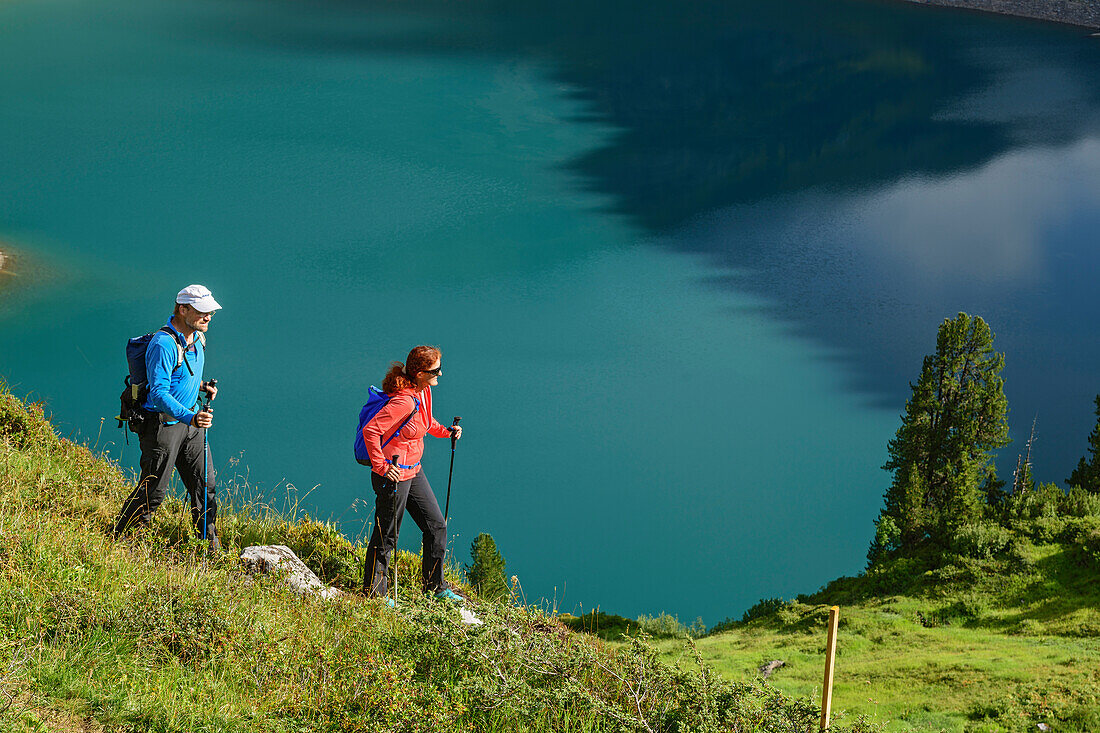 A man and a woman, Lechweg hiking above the Salvar Insee, Lech source mountains, Vorarlberg, Austria