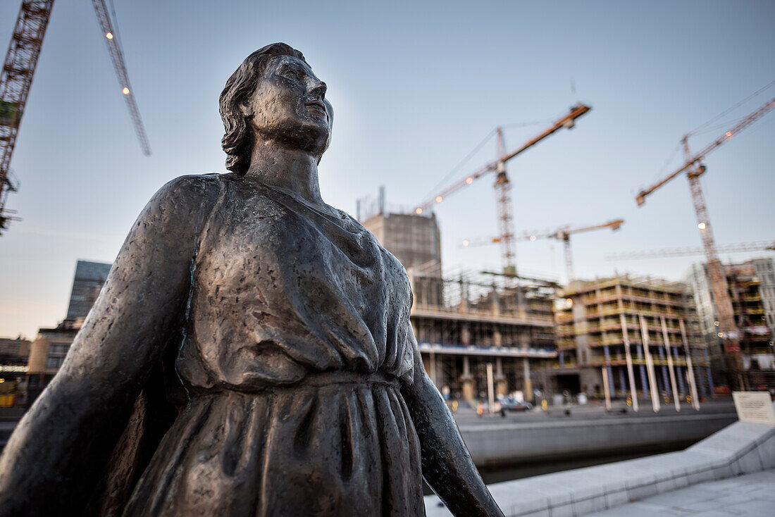 statue in front of Opera, construction site and cranes in background, the New Opera House in Oslo, Norway, Scandinavia, Europe