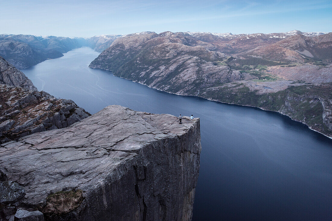 one person sitting with tailor seat at Preikestolen or Prekestolen, Lysefjord, Rogaland Province, Norway, Scandinavia, Europe