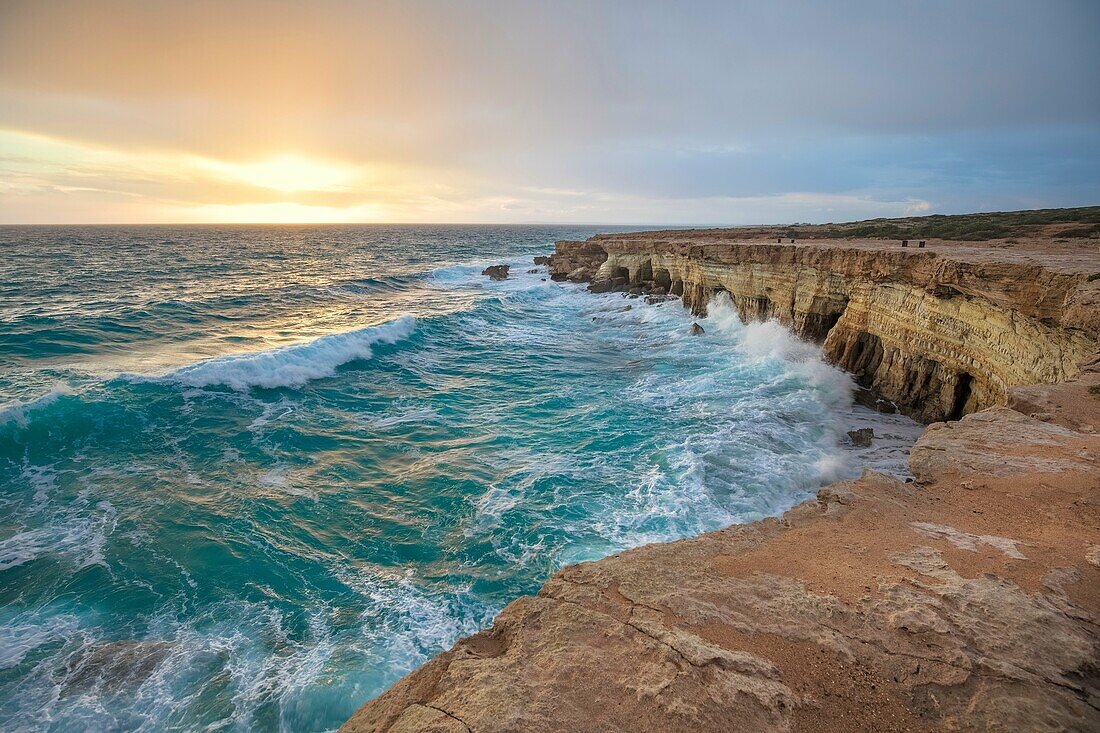 Cyprus, Ayia Napa, The sea caves at Cape Greco at sunset after a storm.