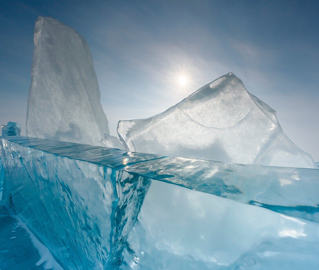 Pieces of transparent ice with sun reflection at lake Baikal, Irkutsk region, Siberia, Russia.