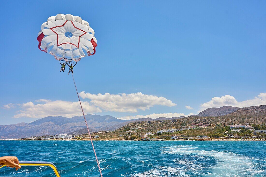 Couple during parasailing. Chersonissos. Crete, Greece.