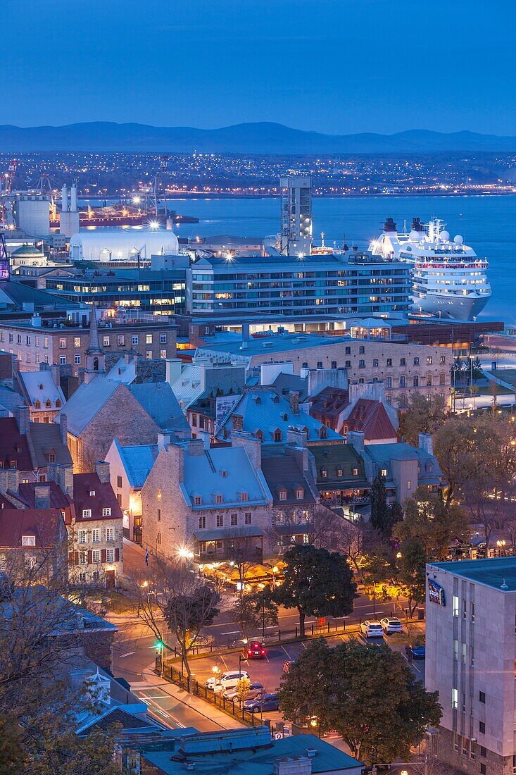 Canada, Quebec, Quebec City, elevated view of the Old Lower Town and cruiseship, evening.