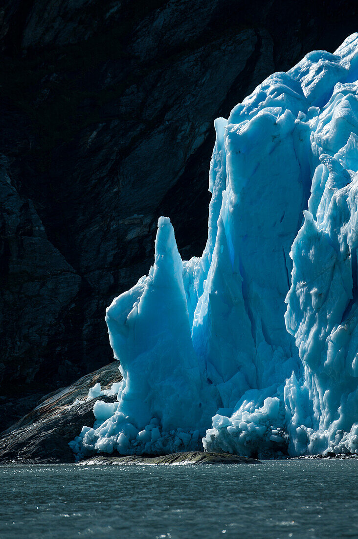 Towers of blue ice shine at the glacier edge, Garibaldi Glacier, near Beagle Canal, Alberto de Agostini National Park, Magallanes y de la Antartica Chilena, Patagonia, Chile, South America