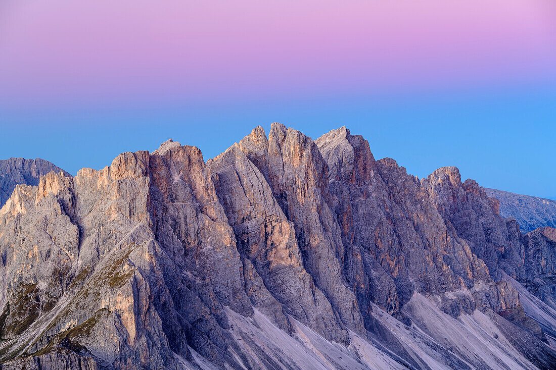 Rockfaces of Geisler Range during blue hour with twilight wedge, from Peitlerkofel, Dolomites, UNESCO World Heritage Site Dolomites, South Tyrol, Italy