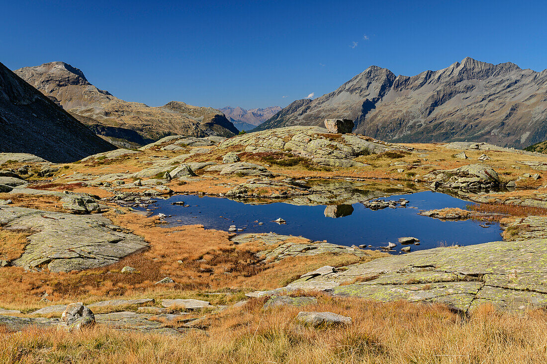 Mountain lake with Grosser Moosstock and Durreck in background, valley of Reinbachtal, Rieserferner Group, South Tyrol, Italy