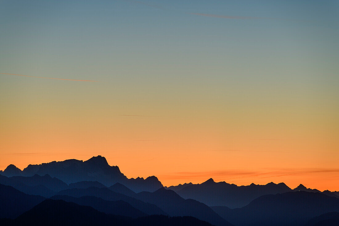 Silhouettes of Zugspitze, Daniel, Thaneller and Hochvogel against evening sky, from Spitzing area, Mangfall Mountains, Bavarian Alps, Upper Bavaria, Bavaria, Germany