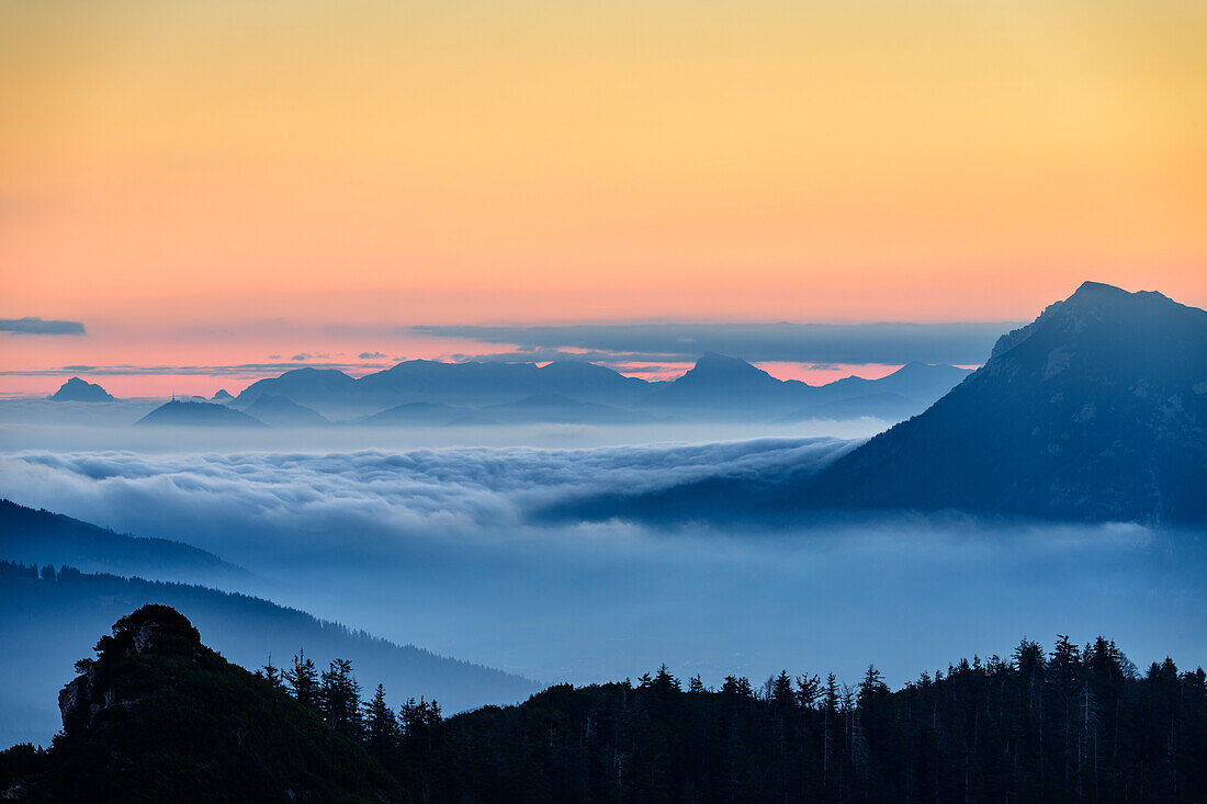 Silhouettes of Traunstein, Hoellengebirge range, Salzkammergut and Zwiesel at dawn, from Hochfelln, Chiemgau Alps, Upper Bavaria, Bavaria, Germany