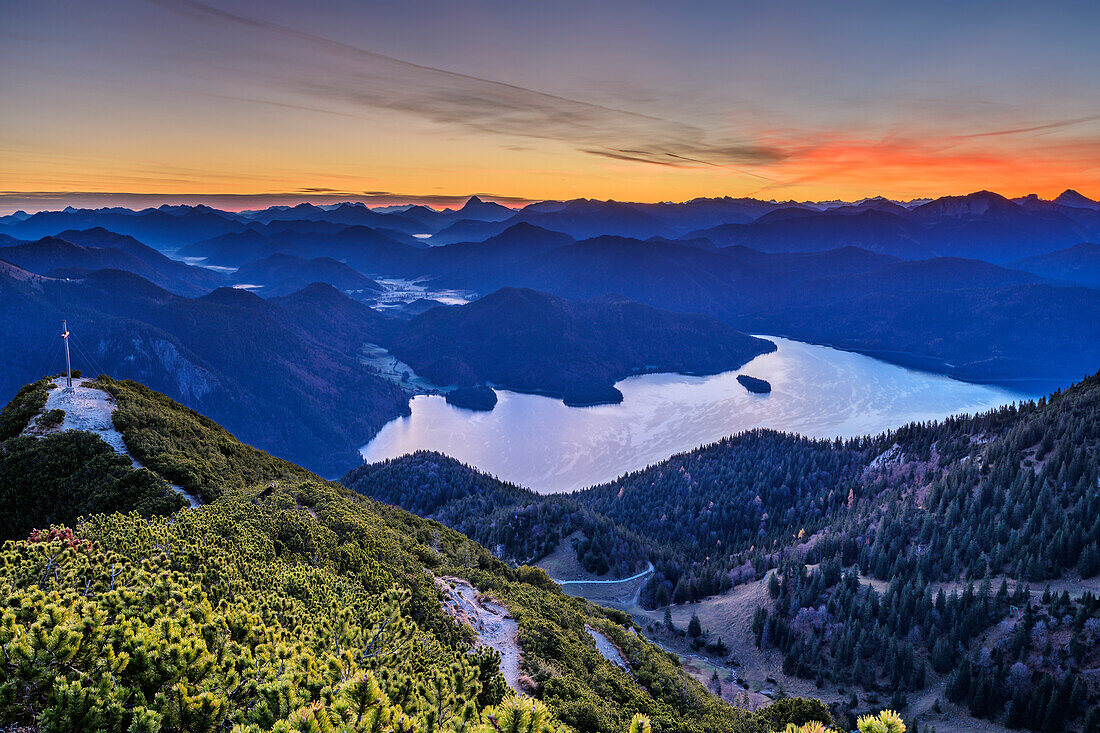 Morning mood above lake Walchensee with cross at summit of Herzogstand, Rofan and Karwendel range in background, from Herzogstand, Bavarian Alps, Upper Bavaria, Bavaria, Germany