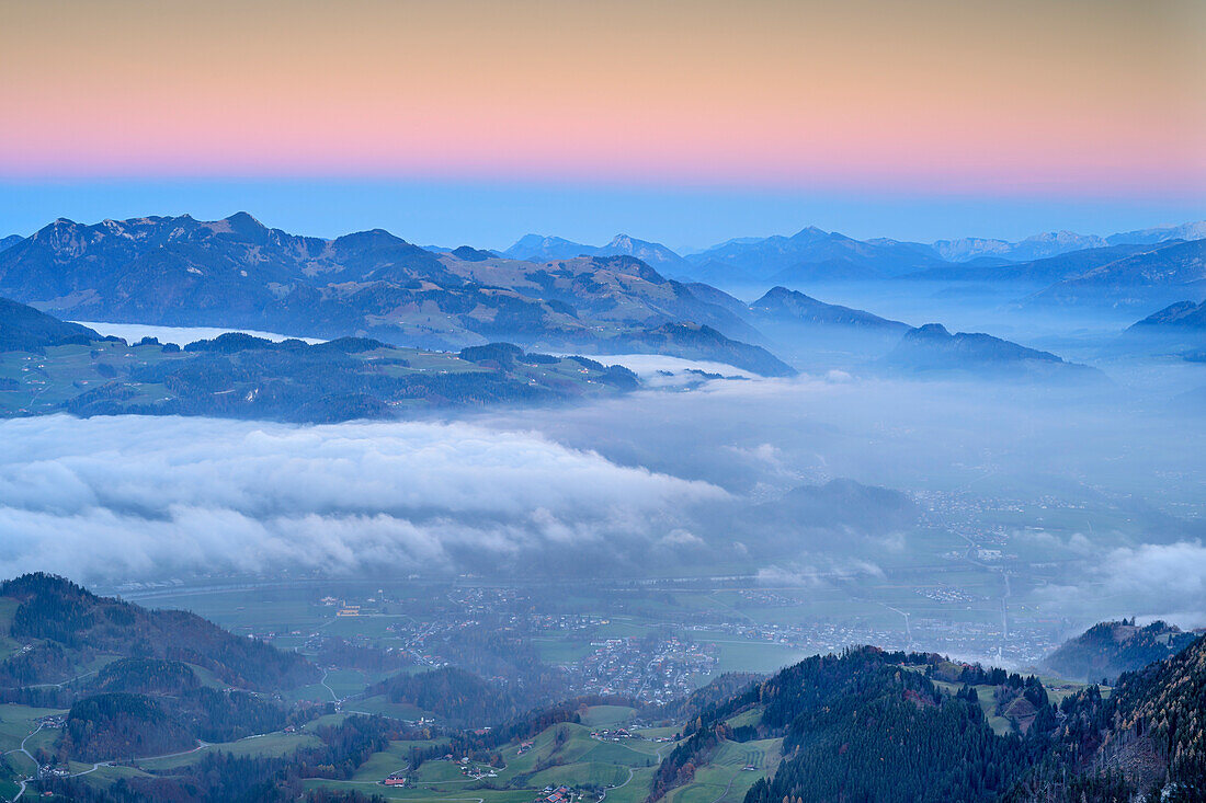 Sea of fog at valley of Inntal with Chiemgau Alps in background after sunset, Bruennstein, Mangfall Mountains, Bavarian Alps, Upper Bavaria, Bavaria, Germany