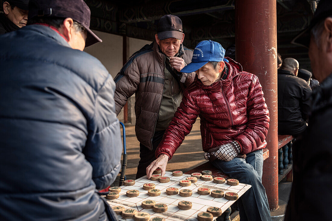 Chinese Men play board game at Temple of the Heaven Park, Beijing, China, Asia, UNESCO World Heritage