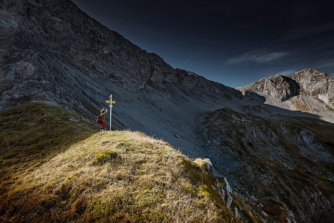 Hiker on the way to the top of Daniel Mountain, Daniel mountain, Ammergau Alps, Tyrol, Austria