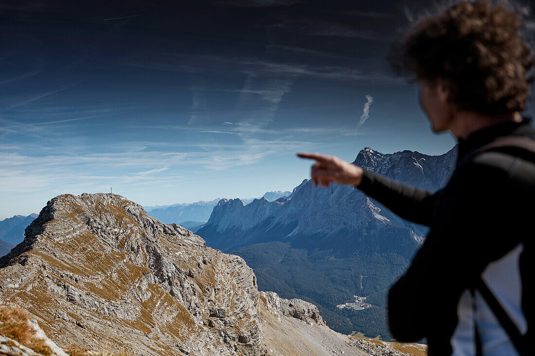 Hiker on the way to the top of Daniel Mountain, Daniel mountain, Ammergau Alps, Tyrol, Austria
