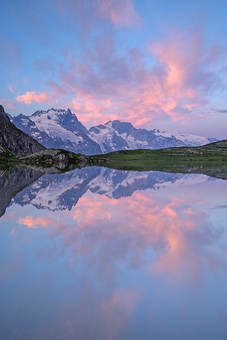 Mood of clouds above lake Lac du Goléon with hut Refuge du Goléon and view towards Meije in Ecrins region, lake Lac du Goléon, National Park Ecrins, Dauphine, Dauphiné, Hautes Alpes, France