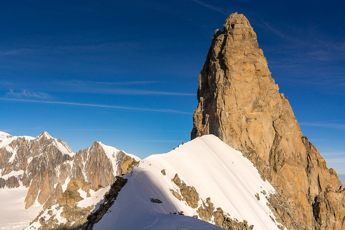 Climbers at the beginning of Rochefortgrat below the Dent du Geant, Aguille de Rochefort, Mont Blanc group, France