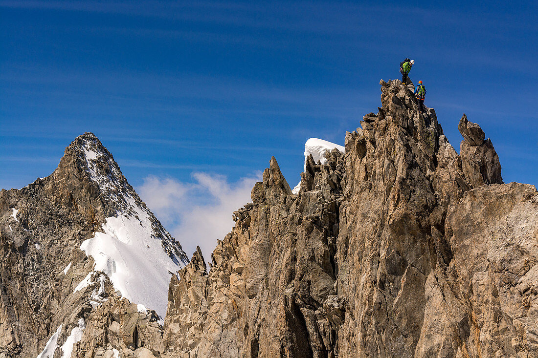 Two climbers in rope team at rock, Rochefort, Mont Blanc group, France