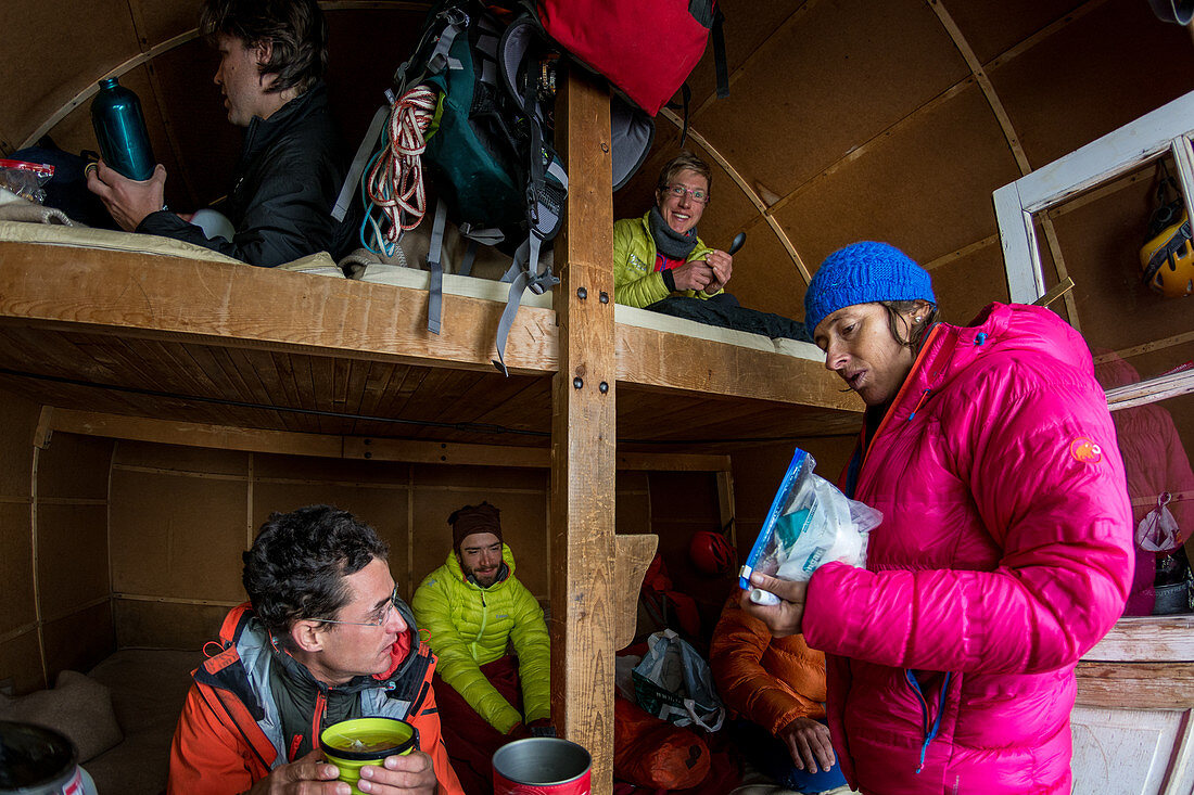 Group of climbers in bivouac Ettore Canzio, Grandes Jorasses, Mont Blanc group, France