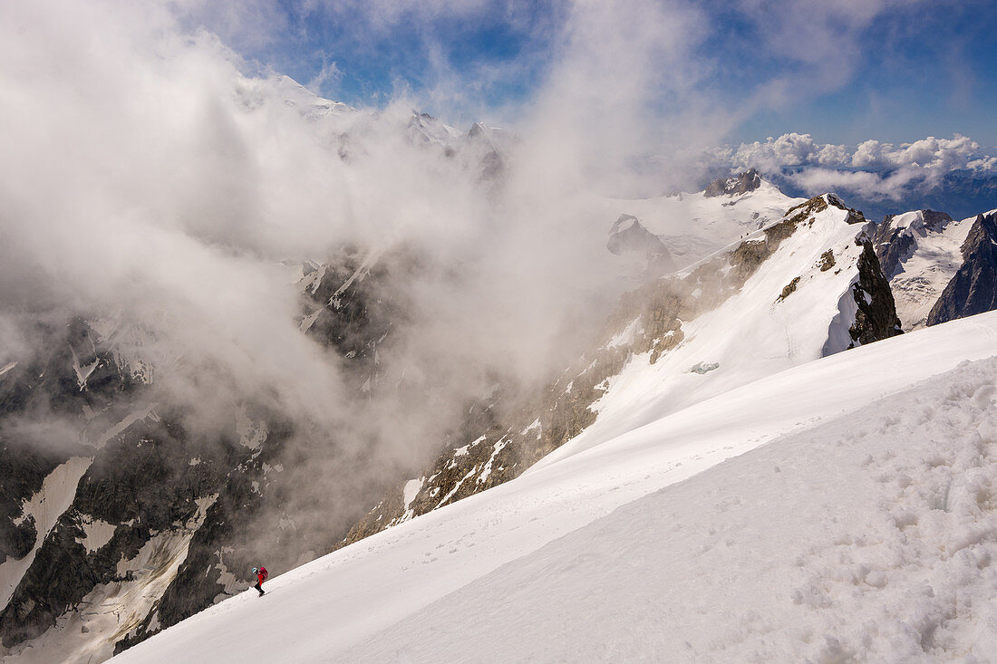 Climber in the descent of Pointe Walker, Grandes Jorasses, Mont Blanc group, France