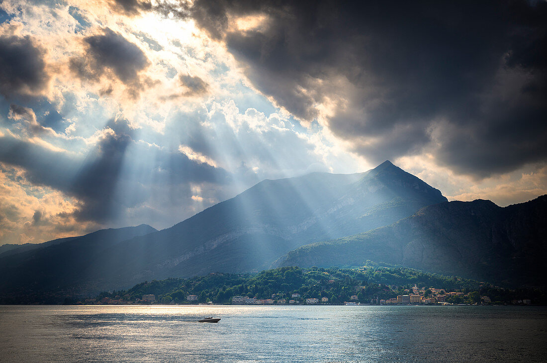 Ray of  sunlight on the lake. Bellagio, Province of Como,  Como Lake, Lombardy, Italy, Europe.