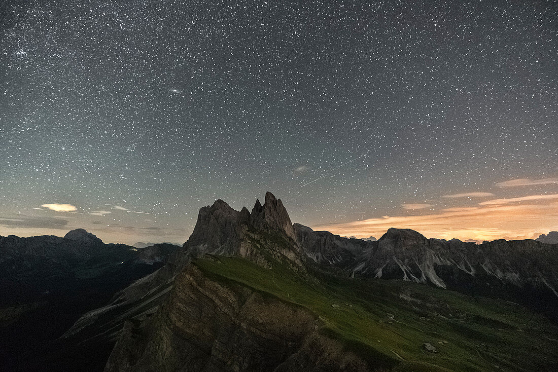 Seceda peaks under a starry sky in summer. Ortisei, Bolzano province, Trentino Alto Adige, Italy.