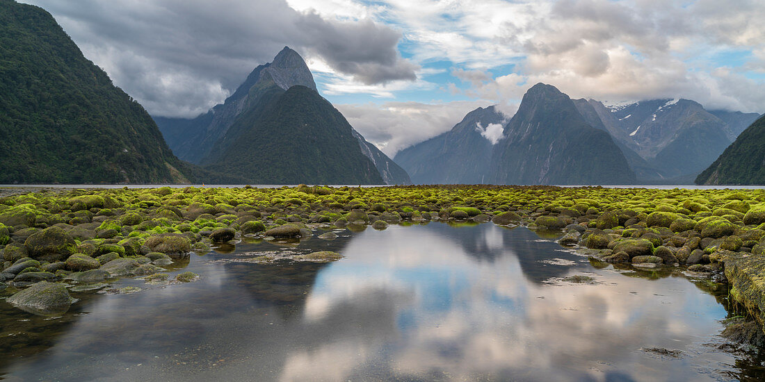 Reflection of Milford Sound with low tide. Fiordland NP, Southland district, Southland region, South Island, New Zealand.