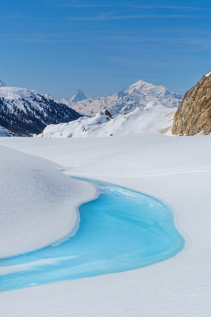 Light blue glacial water into the glacier. Aletschglacier, Vallese, Switzerland, Europe.