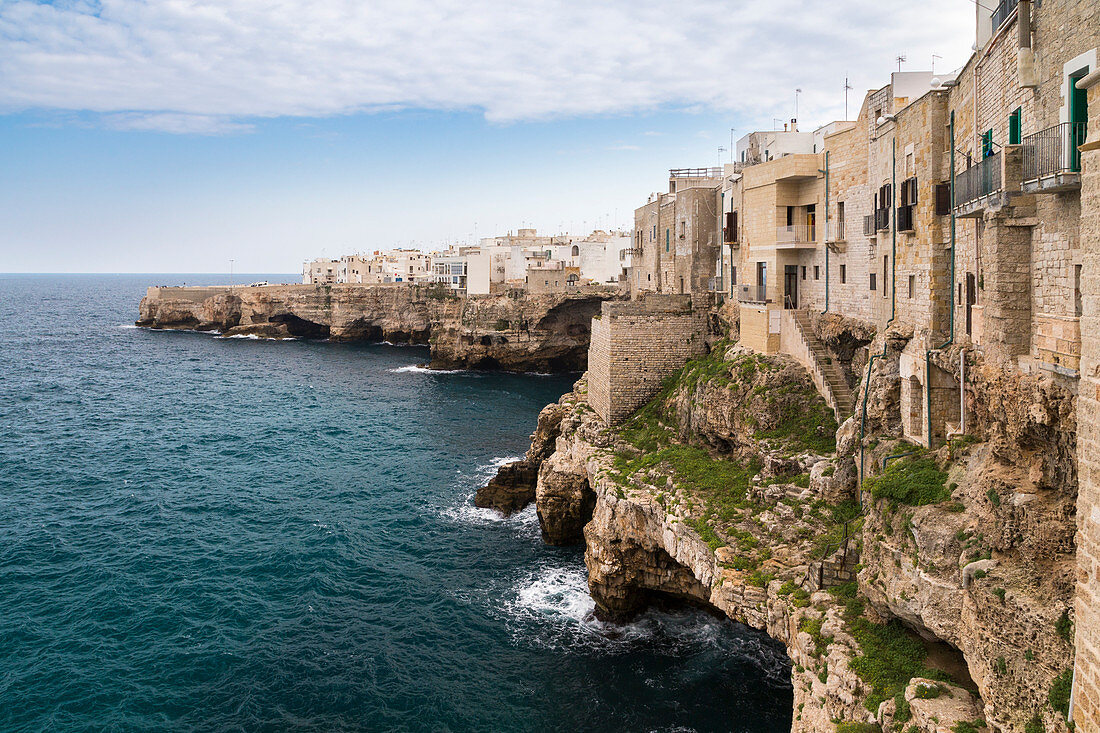 View of the overhanging houses and caves of Polignano a Mare. Bari district, Apulia, Italy, Europe.