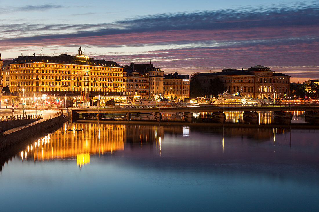 Buildings by river at sunset in Stockholm, Sweden