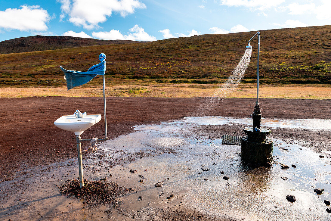 A hot spot with shower and a sink at Hverir, Krafla caldera, Myvatn region, Northern Iceland. Geothermal activity.