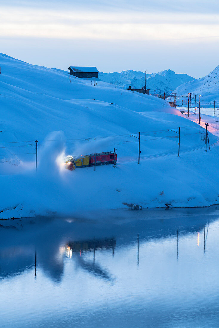 Turbine snowplow in action, Lago Bianco, Bernina Pass, Canton of Graubunden, Engadin, Switzerland