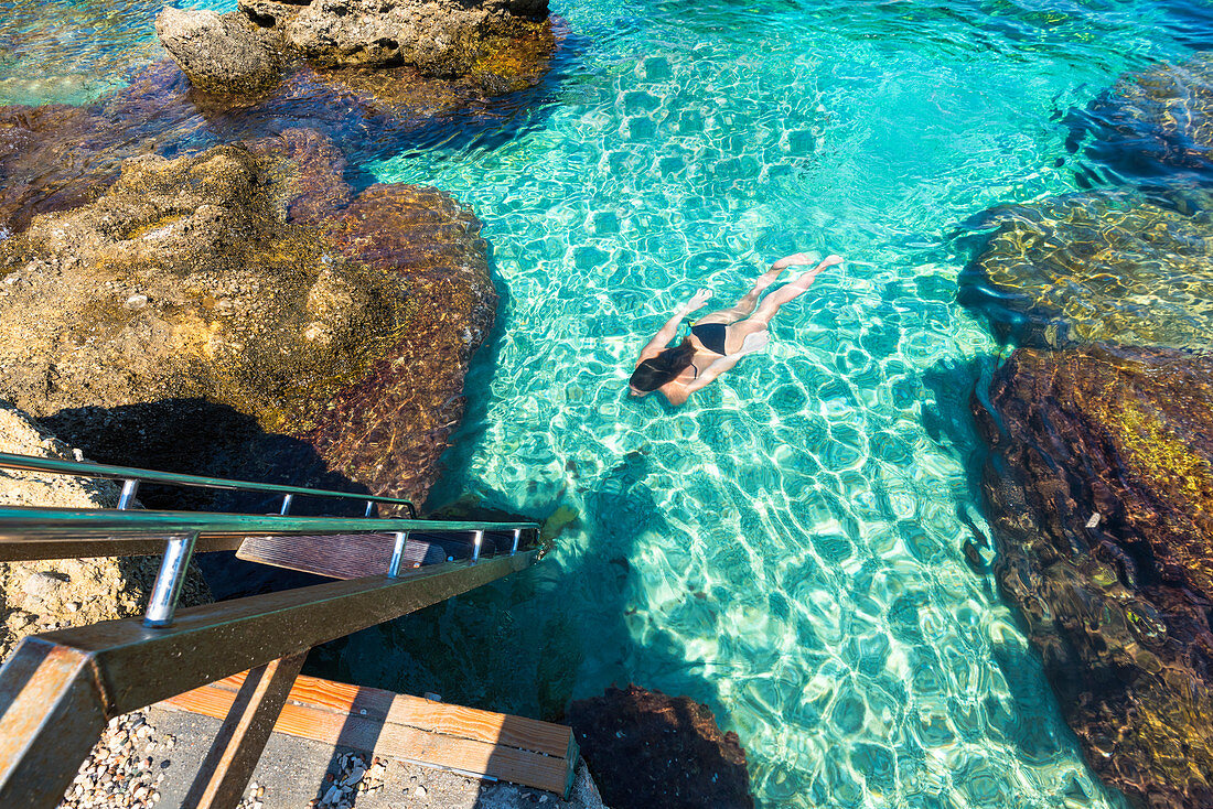 Kallithea,Rhodes,Greece. Girl swims in the bay of Kallithea.