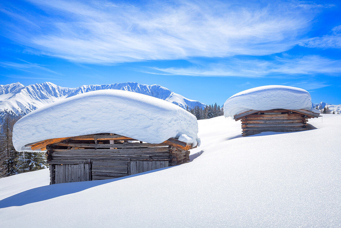 Typical alpine huts after a heavy snowfall. Wiesner Alp, Davos Wiesen, Landwasser Valley, Albula Valley, District of Prattigau/Davos, Canton of Graub?nden, Switzerland, Europe.