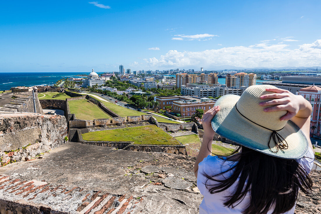 Young woman, view of the old town, Fortress de San Cristóbal, San Juan, Puerto Rico, Caribbean, USA