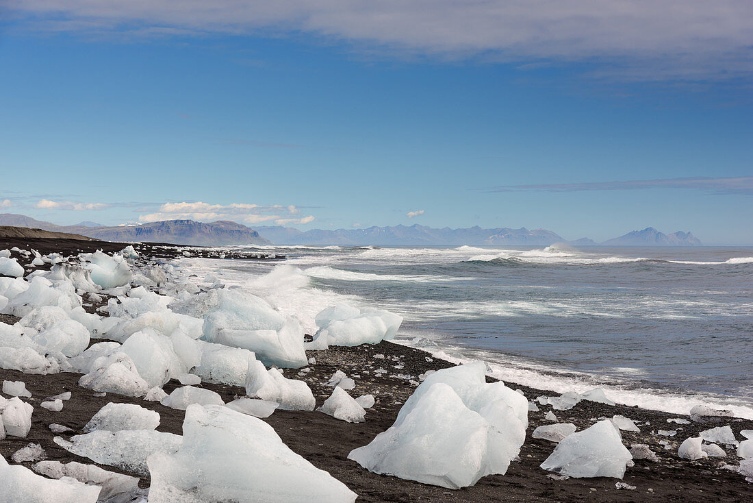 Chunks of ice on shore of Fjallsárlón glacier lake in Iceland, Europe