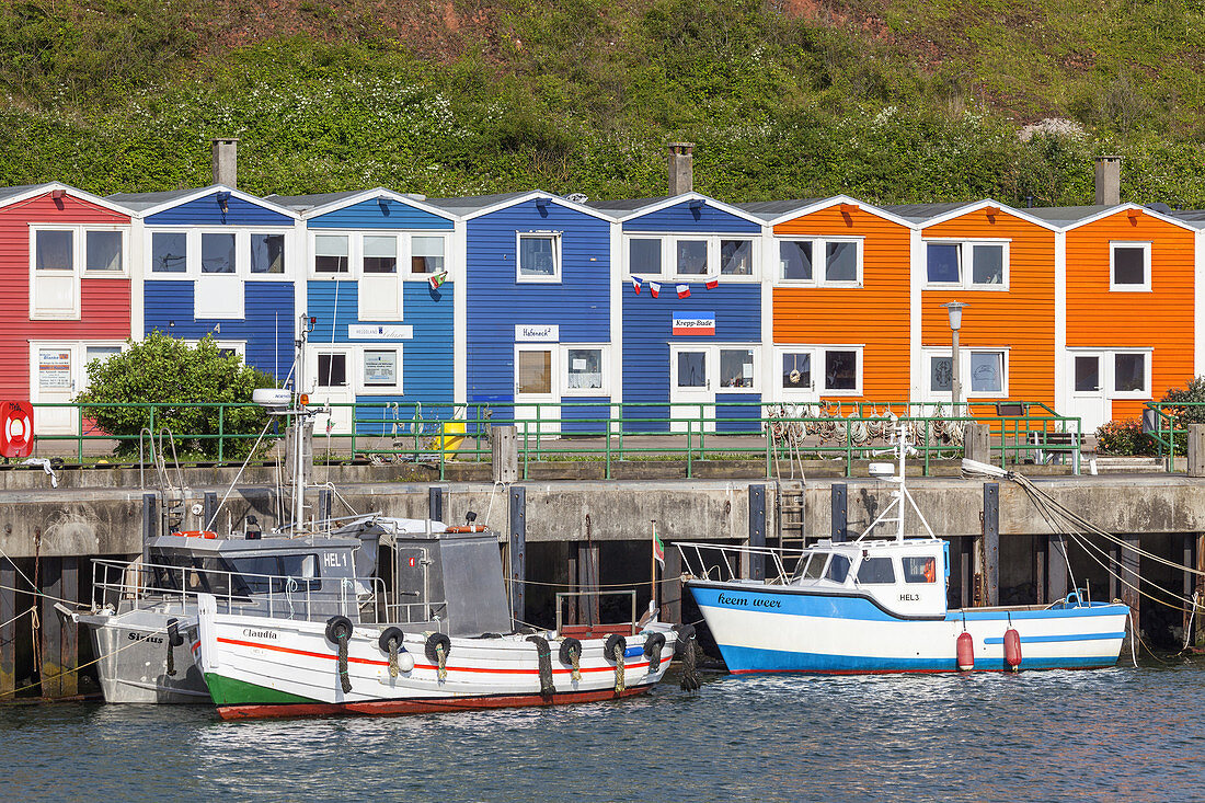 Coloured huts and wodden boats in the harbour, North Sea island Helgoland, Schleswig-Holstein, Northern Germany, Germany, Europe