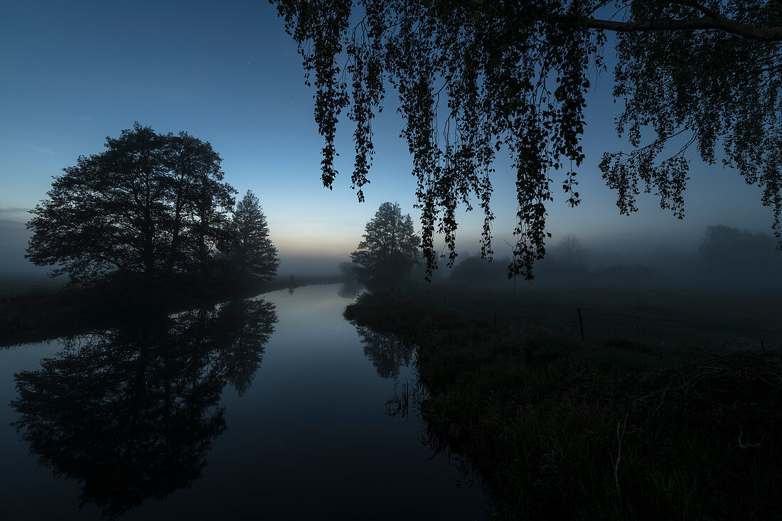 At the blue hour, the countless rivers of the Spreewald turn into a fairytale landscape