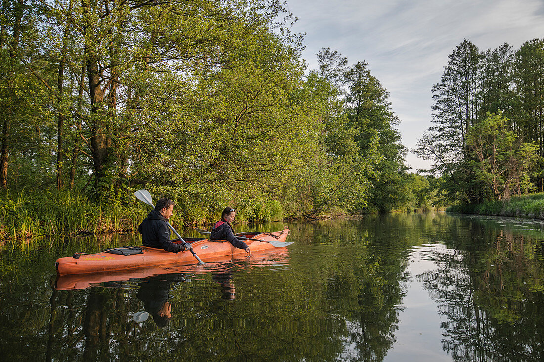 Water hiking by kayak through the UNESCO biosphere reserve Spreewald in Brandenburg,