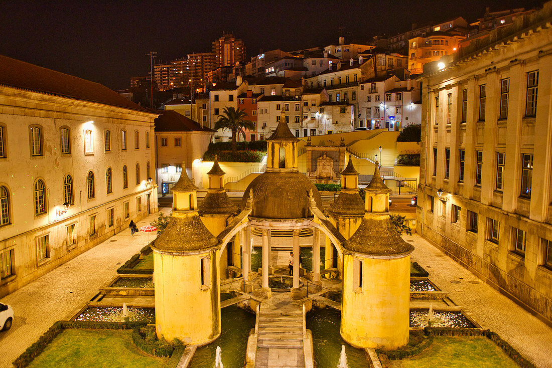 Fountain next to the covered market at night, Manga Cloister, Jardim da Manga, Coimbra, Beira, Central Portugal, Portugal