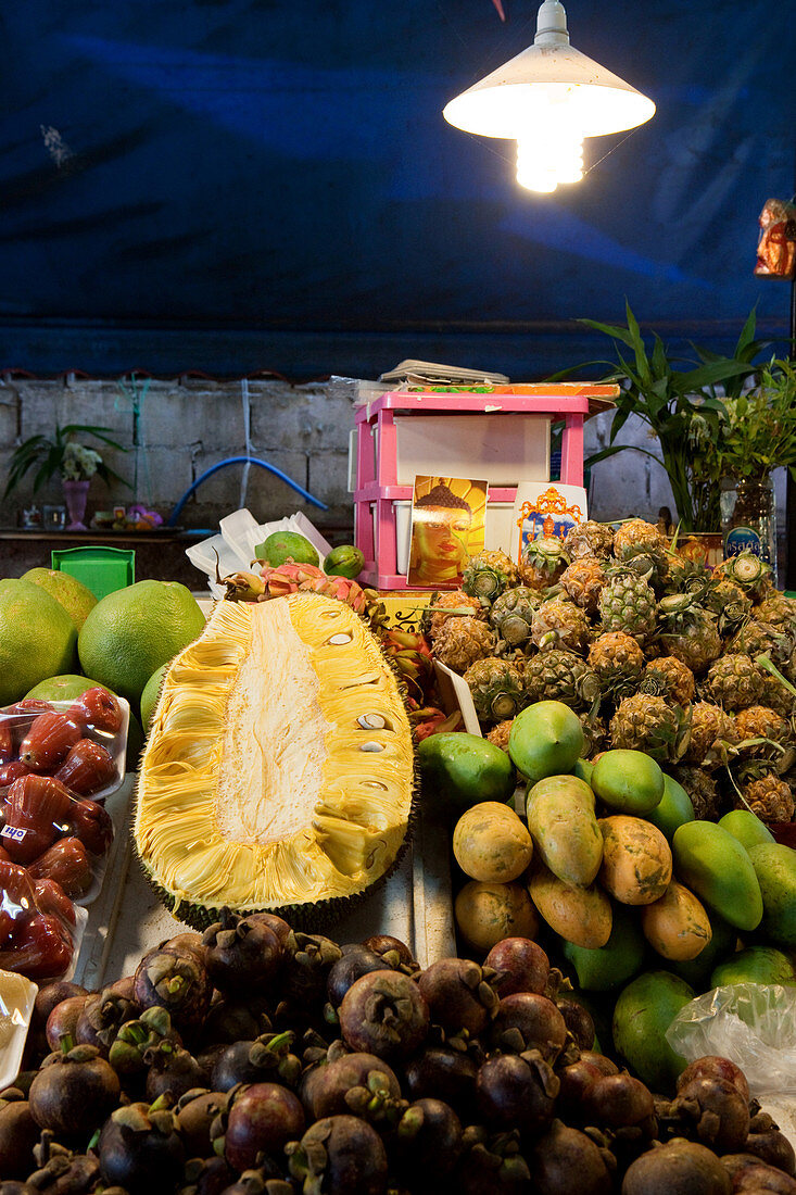 Fruit stand with, mangosteen, mangoes, jackfruit, pineapple and pomelo, Chiang Mai, Thailand