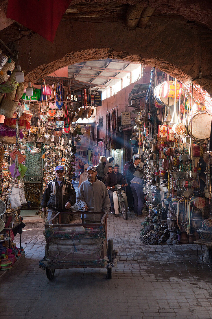 In the middle of the bustle in the souks of Marrakech, Marrakech, Morocco