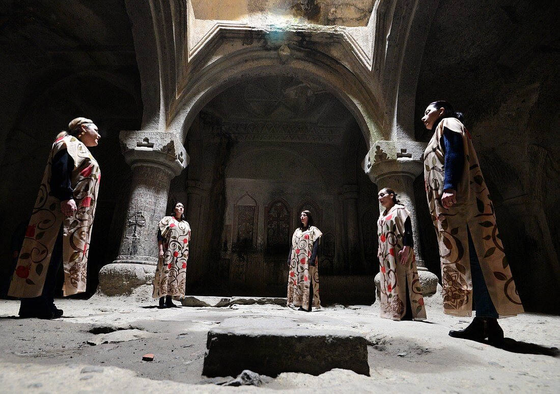 Singers of chorales in the early Christian monastery Gerghard, Garni east of Yerevan, Armenia, Asia