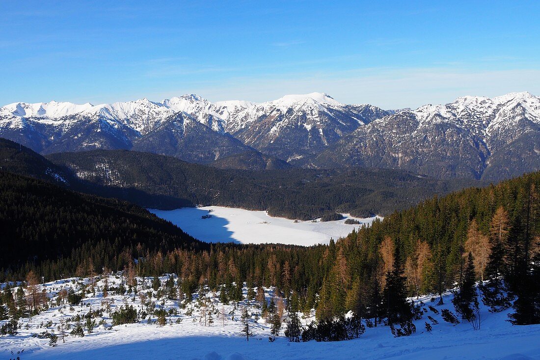 Eibsee in the mountain landscape in winter under the Zugspitze at Garmisch-Partenkirchen, Bavaria, Germany