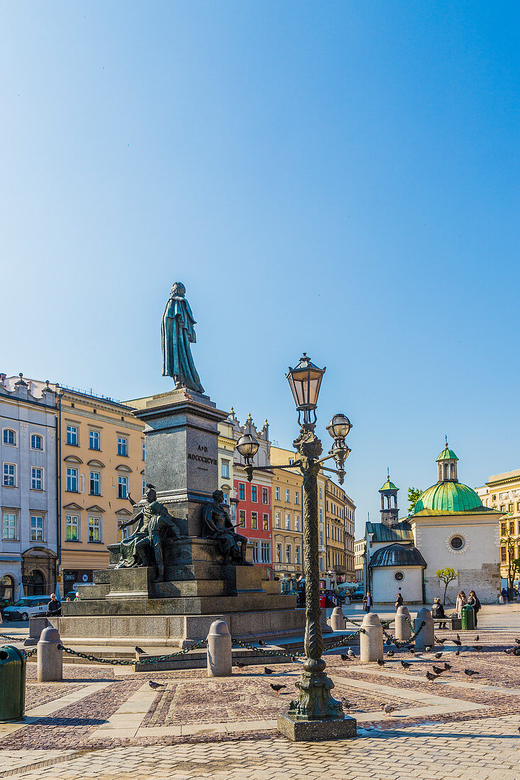 The Adam Mickiewicz Monument in the main Square in the medieval old town, UNESCO World Heritage Site, Krakow, Poland, Europe