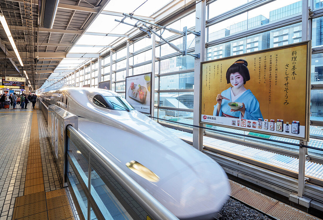 Shinkansen high speed bullet train and poster of a geisha, Kyoto, Japan, Asia