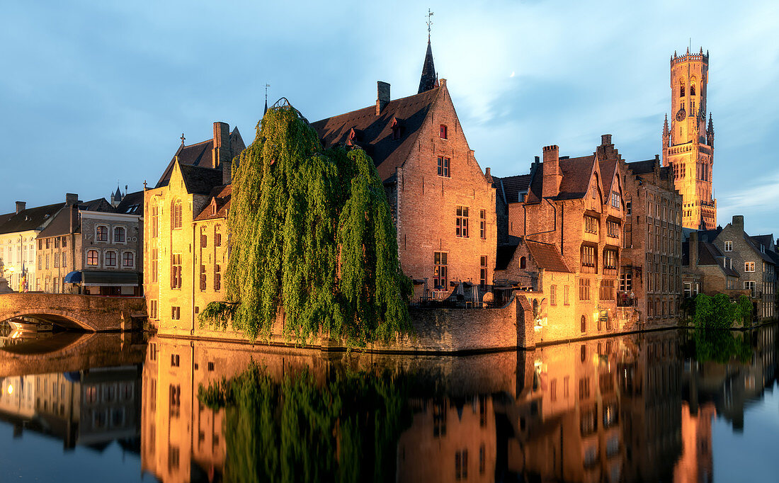 Medieval City Centre, UNESCO World Heritage Site, framed by Rozenhoedkaai canal at night, Bruges, West Flanders, Belgium, Europe