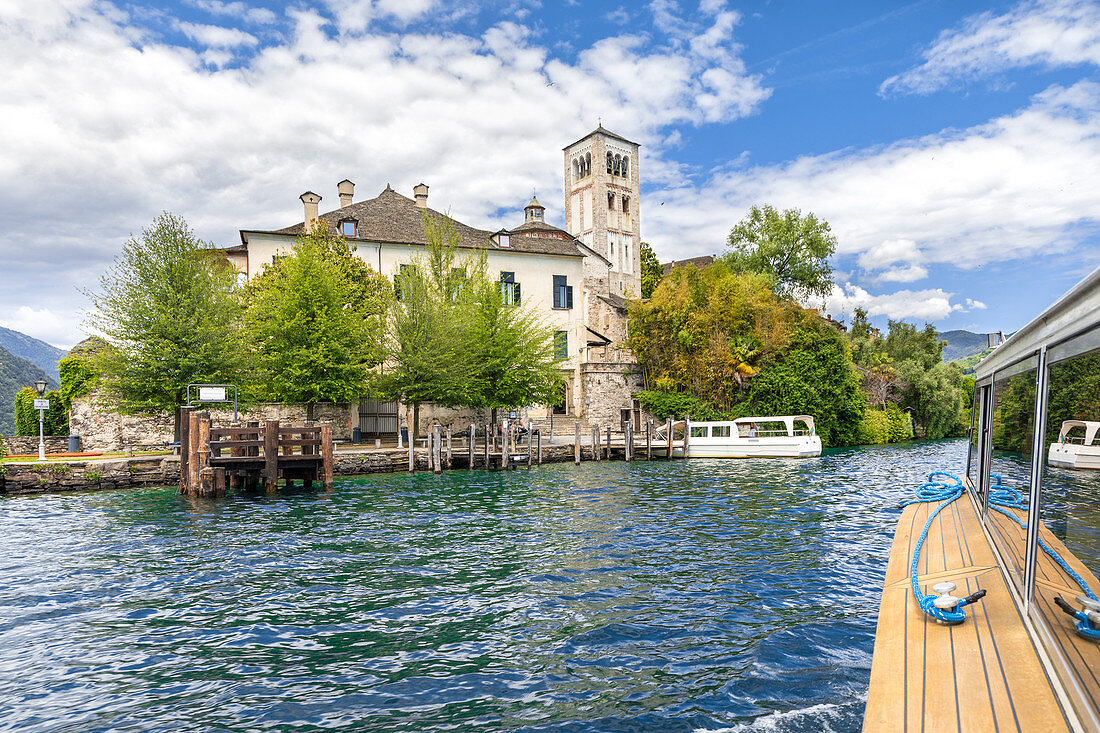 Arriving at the Island of San Giulio with a small boat you can see the Basilica of San Giulio (Orta San Giulio, Lake Orta, Novara province, Piedmont, Italy, Europe)