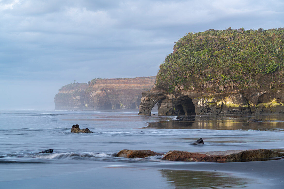 Rock formations at the Three Sisters. Tongaporutu, New Plymouth district. Taranaki region, North Island, New Zealand.